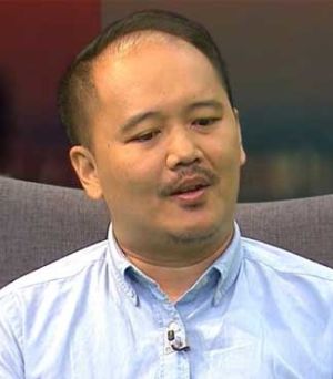 Desonny Tuzan says the heavy school bags take a toll on the young bodies of children.