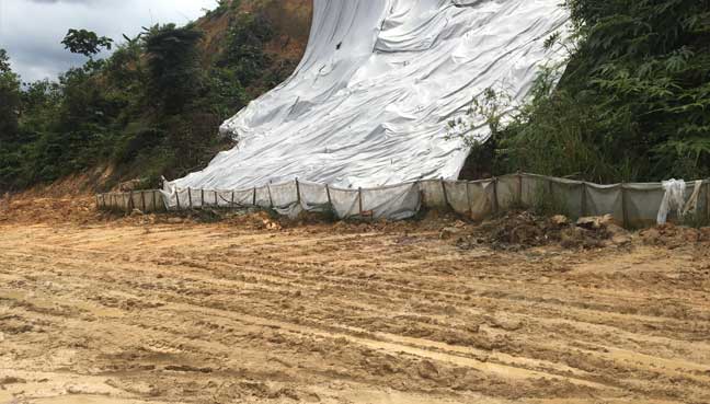 The muddy road near the tahfiz school.