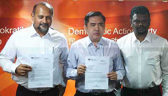 (From left) DAP deputy chairman Gobind Singh Deo, national organising secretary Anthony Loke and Negeri Sembilan DAP assistant secretary Arul Kumar holding the RoS letter recognising the party's central executive committee line-up.
