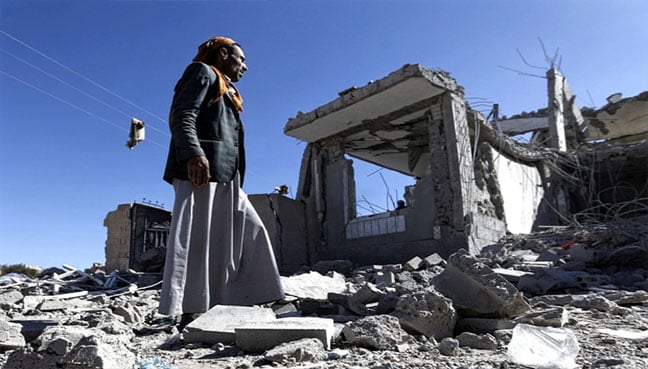 Yemenis check the damage in the aftermath of a reported air strike by the Saudi-led coalition in Sanaa on 8 March (AFP pic)