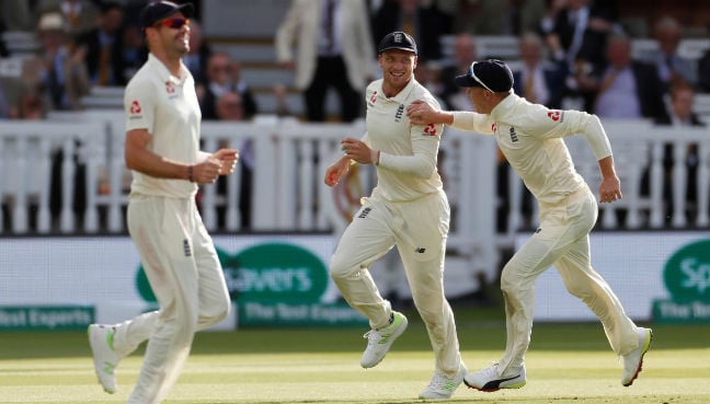 England’s Jos Buttler celebrates taking the wicket of India’s Virat Kohli