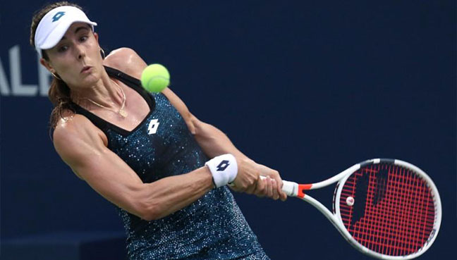 Alize Cornet of France in action