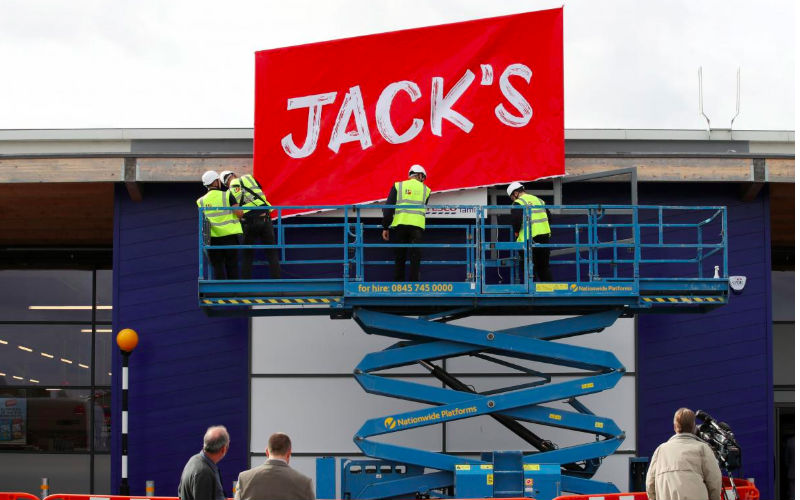 Workers unveil the branding at Tesco’s new discount supermarket Jack’s in Chatteris Britain