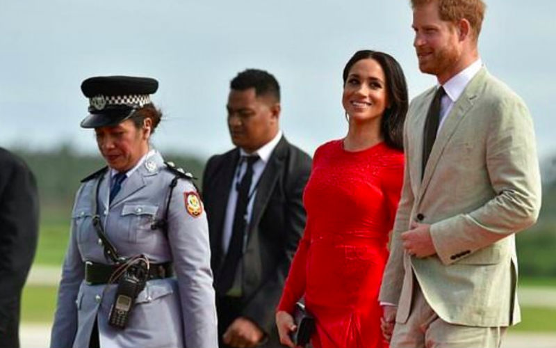 Meghan won over the locals in Tonga with her red dress the same colour as the Tongan flag
