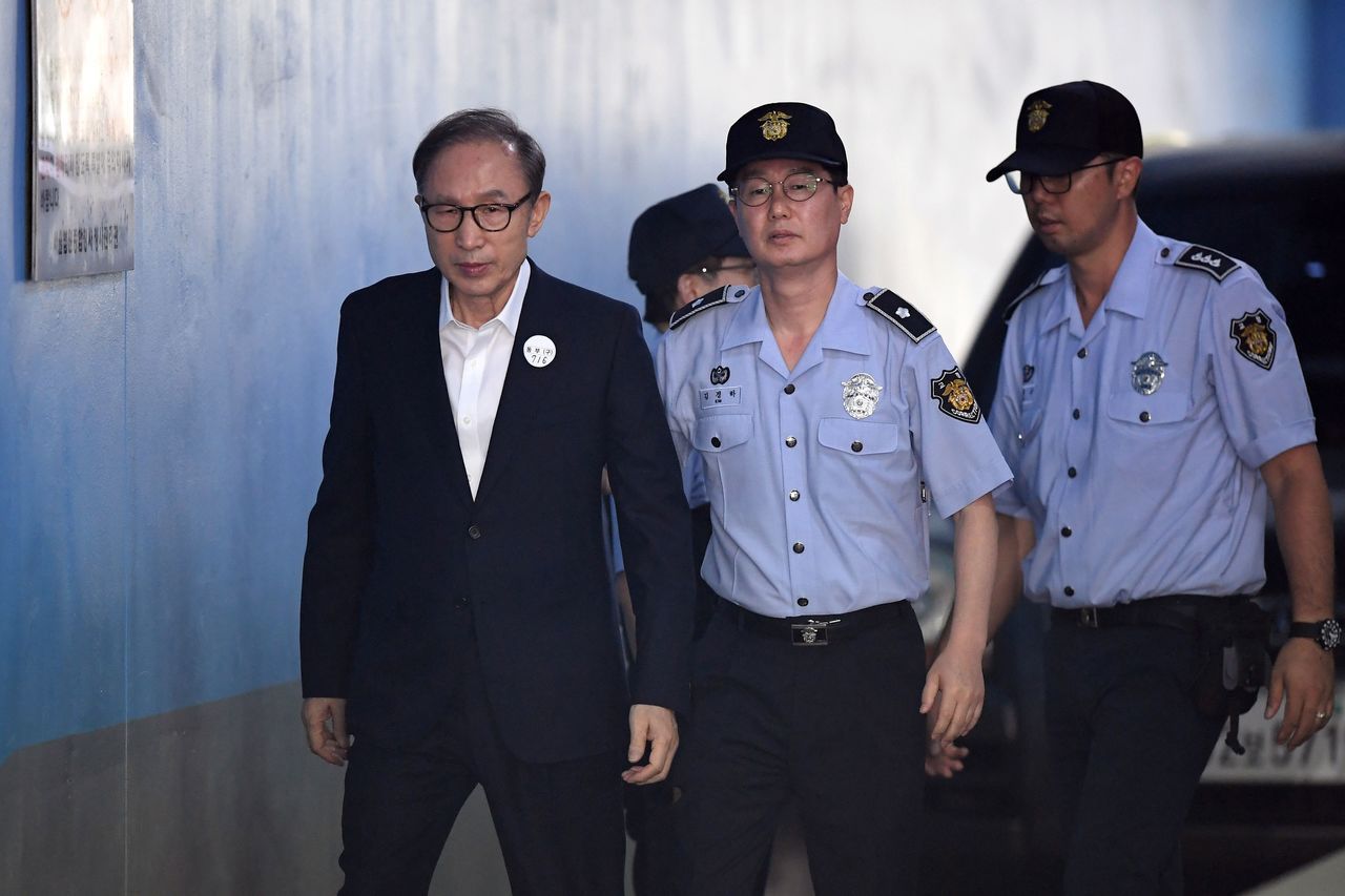 Former President Lee sentenced to 15 years
