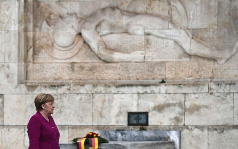 German Chancellor Angela Merkel pays tribute at the Tomb of the Unknown Soldier in Athens