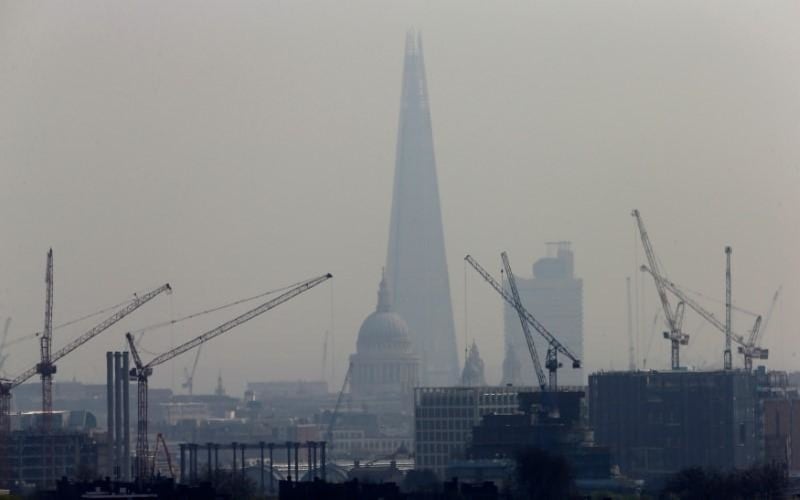 Smog surrounds The Shard and St Paul’s Cathedral in London Britain