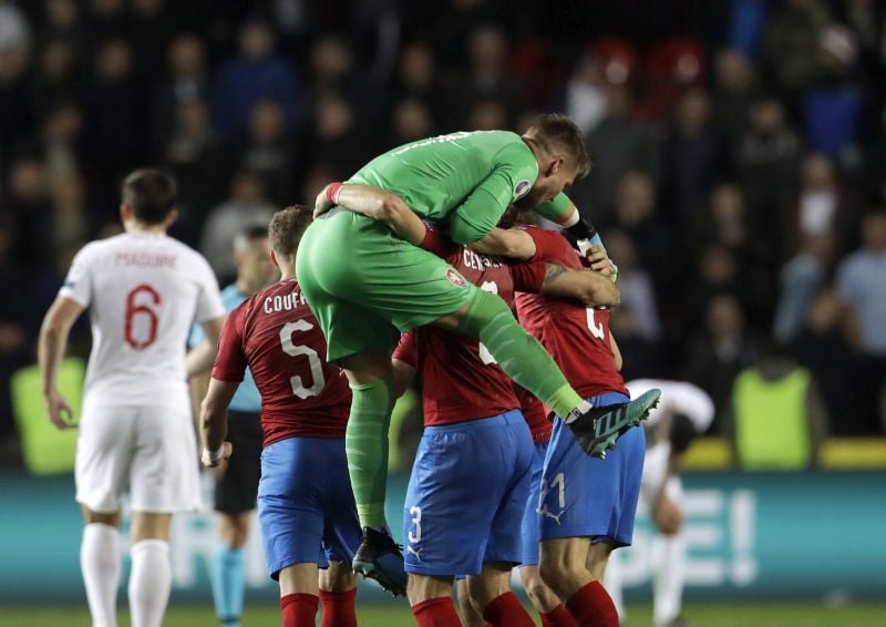 Czech Republic players celebrate defeating England at the end of the game