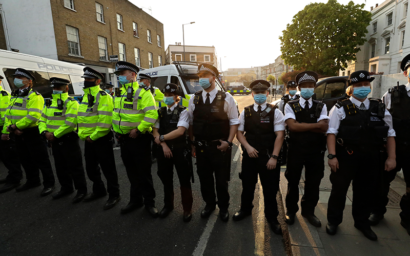 Police officers guard a street in London on Tuesday